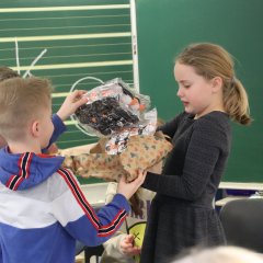Children unwrap a present