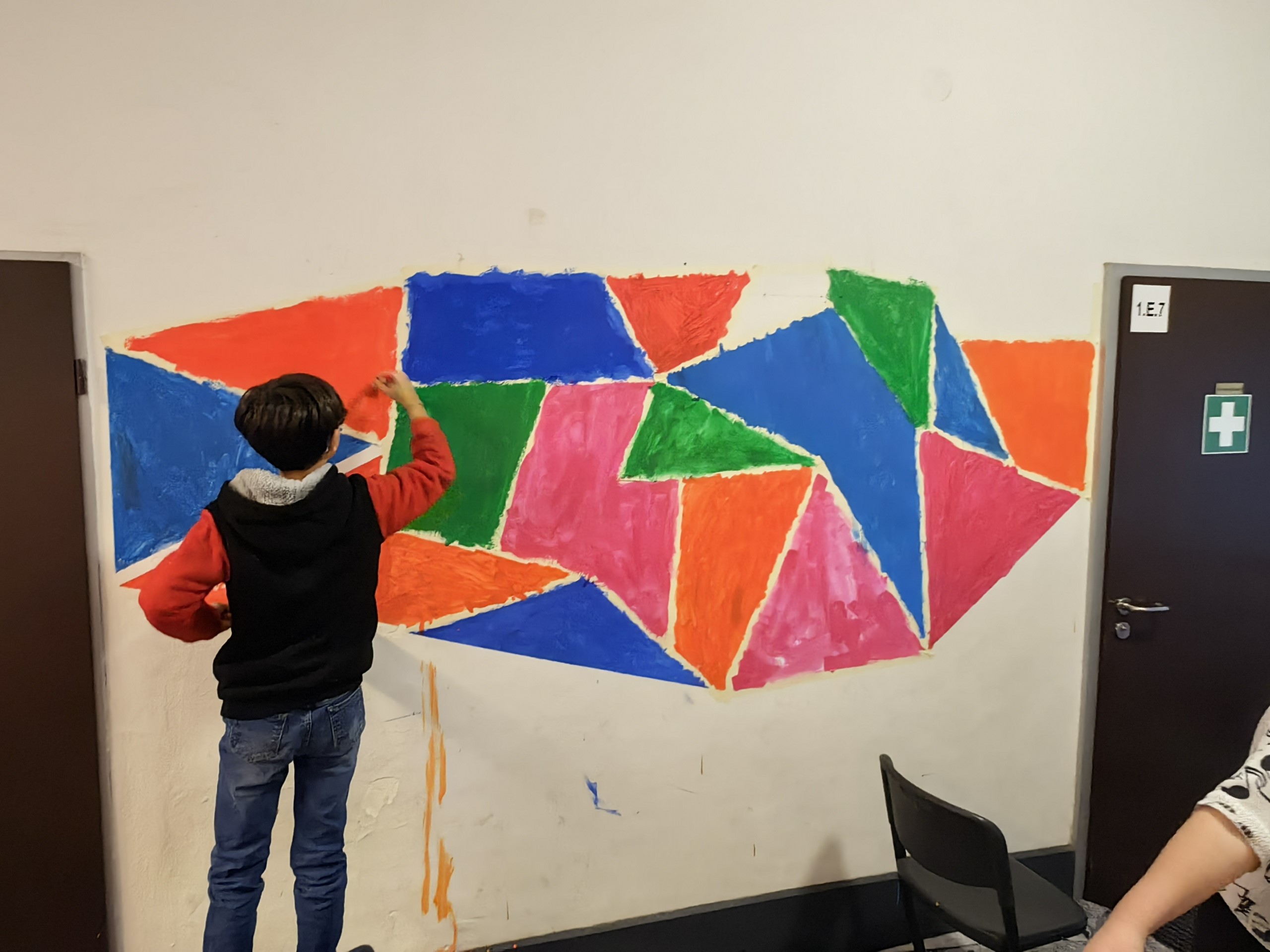 Child paints the wall