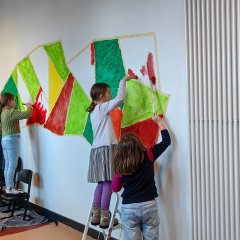 Children paint the wall