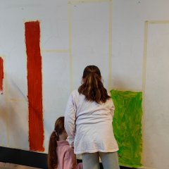 Children paint the wall